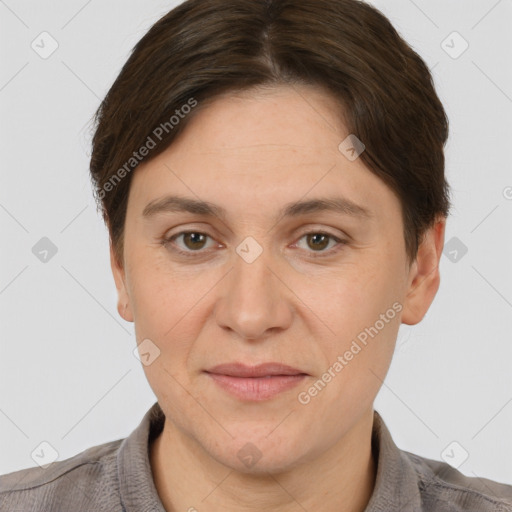 Joyful white adult female with short  brown hair and brown eyes