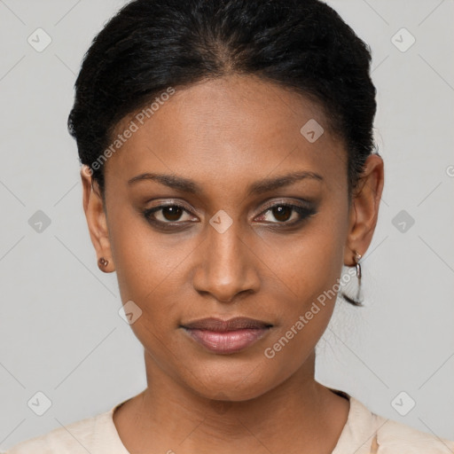 Joyful black young-adult female with short  brown hair and brown eyes