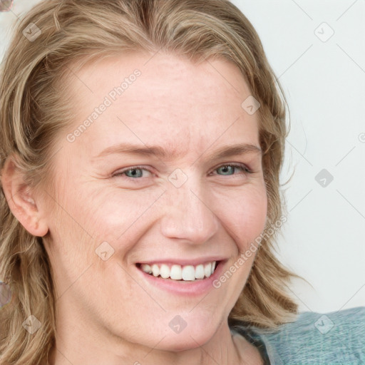 Joyful white young-adult female with medium  brown hair and blue eyes