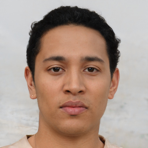Neutral latino young-adult male with short  black hair and brown eyes