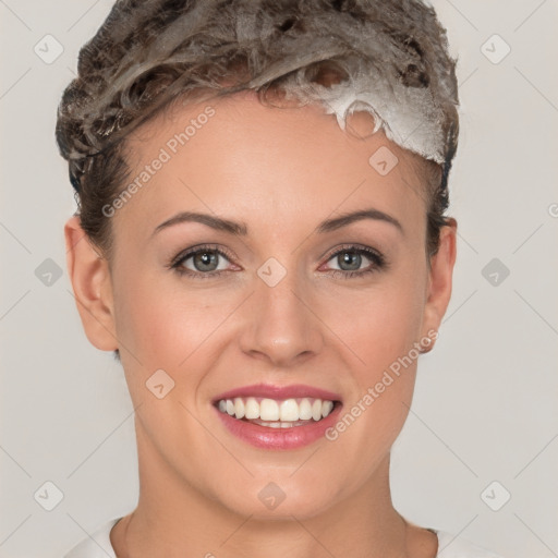 Joyful white young-adult female with short  brown hair and brown eyes