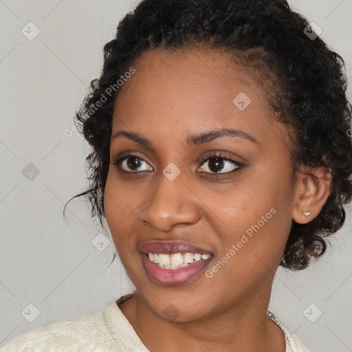 Joyful black young-adult female with medium  brown hair and brown eyes