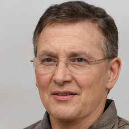 Joyful white middle-aged male with short  brown hair and brown eyes