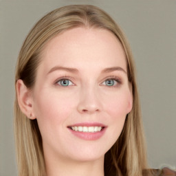 Joyful white young-adult female with long  brown hair and blue eyes