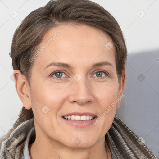 Joyful white adult female with short  brown hair and grey eyes