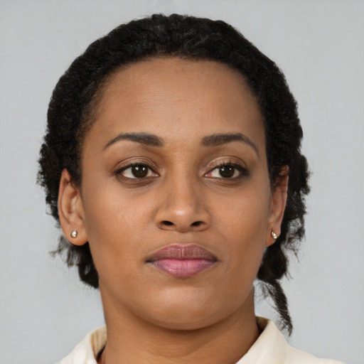 Neutral latino young-adult female with short  brown hair and brown eyes