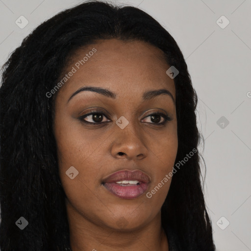 Joyful black young-adult female with long  brown hair and brown eyes