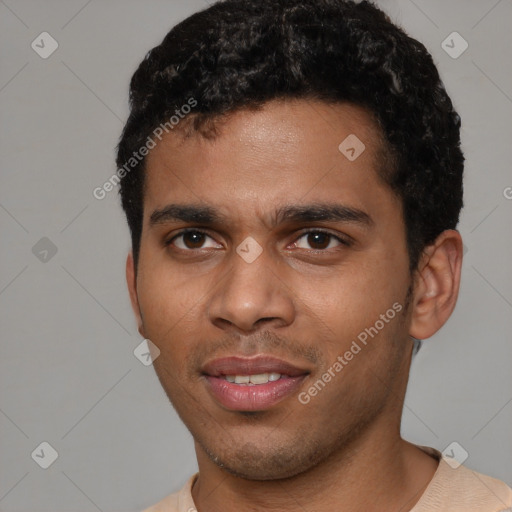 Joyful black young-adult male with short  brown hair and brown eyes
