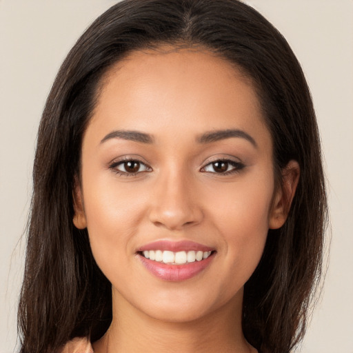 Joyful white young-adult female with long  brown hair and brown eyes