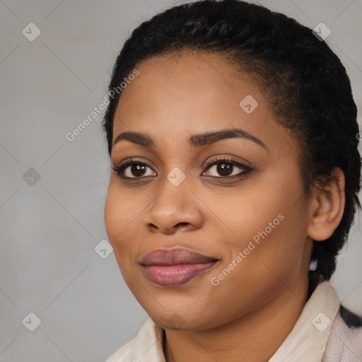 Joyful black young-adult female with medium  black hair and brown eyes