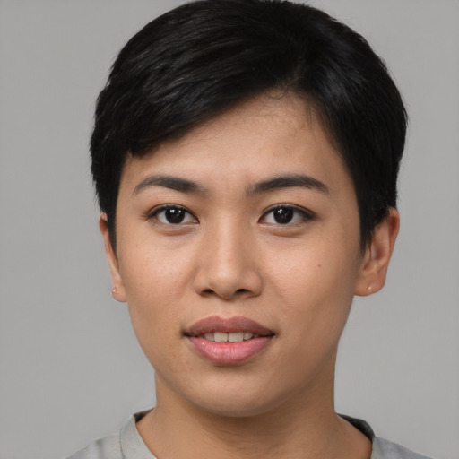 Joyful asian young-adult female with short  black hair and brown eyes