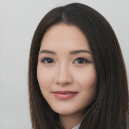 Joyful asian young-adult female with long  brown hair and brown eyes