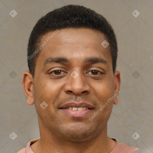 Joyful latino young-adult male with short  brown hair and brown eyes