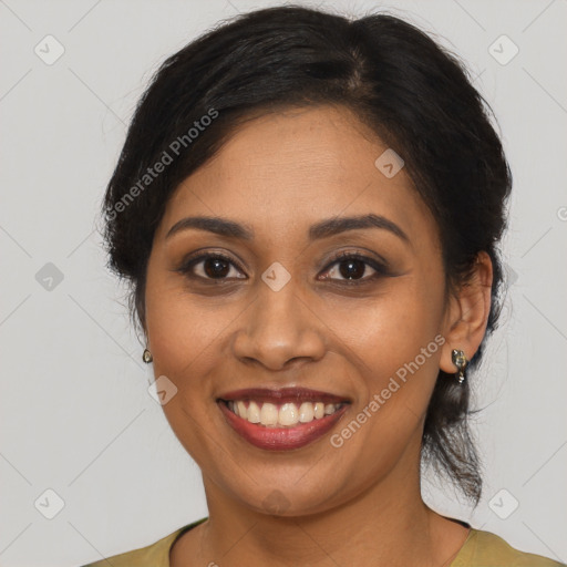 Joyful black young-adult female with medium  brown hair and brown eyes