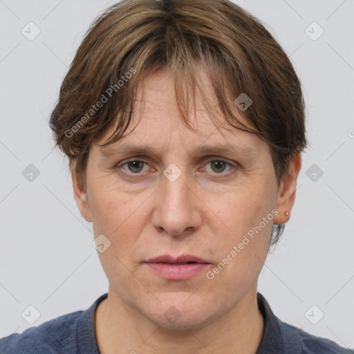 Joyful white adult female with short  brown hair and grey eyes