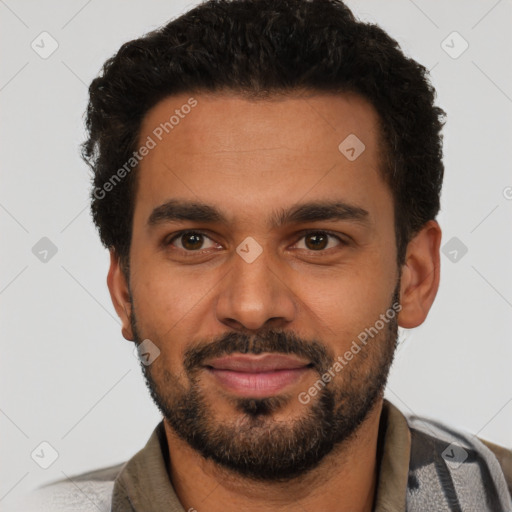 Joyful black young-adult male with short  brown hair and brown eyes