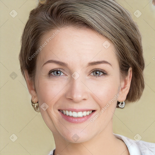 Joyful white young-adult female with short  brown hair and grey eyes