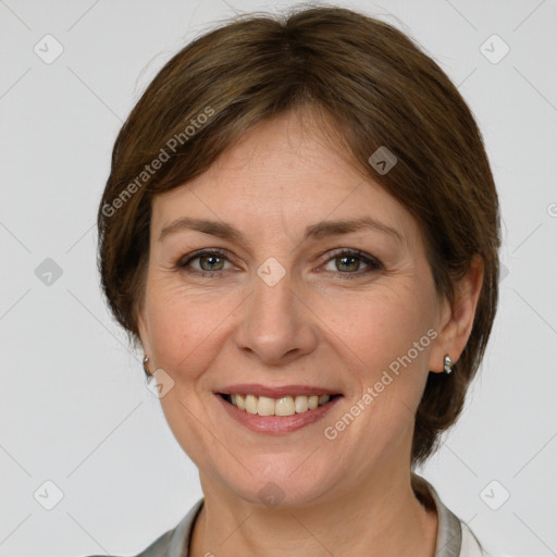 Joyful white adult female with medium  brown hair and grey eyes