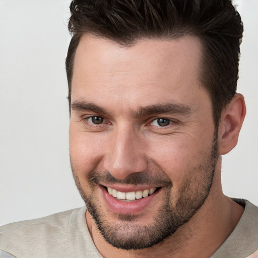 Joyful white young-adult male with short  brown hair and brown eyes