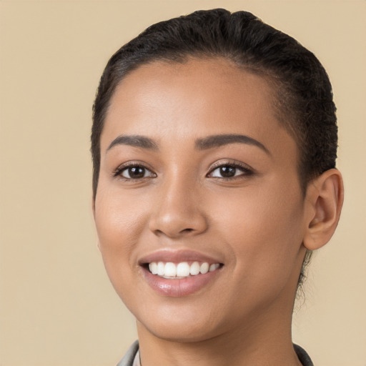 Joyful white young-adult female with short  black hair and brown eyes