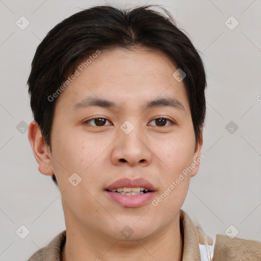 Joyful asian young-adult male with short  brown hair and brown eyes