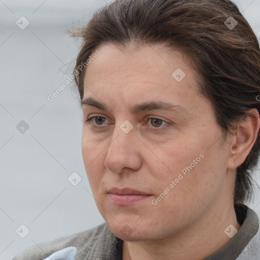 Joyful white adult male with medium  brown hair and brown eyes