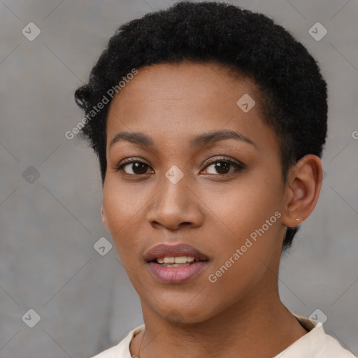 Joyful black young-adult female with short  black hair and brown eyes