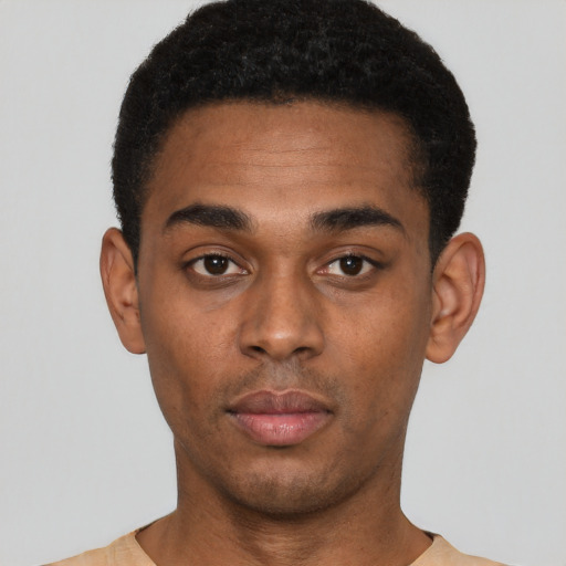 Neutral black young-adult male with short  black hair and brown eyes