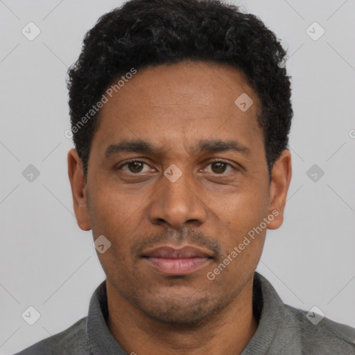 Neutral latino adult male with short  black hair and brown eyes