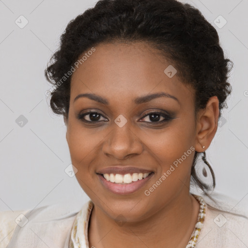 Joyful black young-adult female with long  brown hair and brown eyes