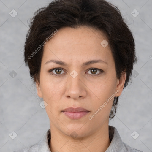 Joyful white adult female with short  brown hair and brown eyes