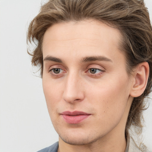 Joyful white young-adult male with medium  brown hair and grey eyes