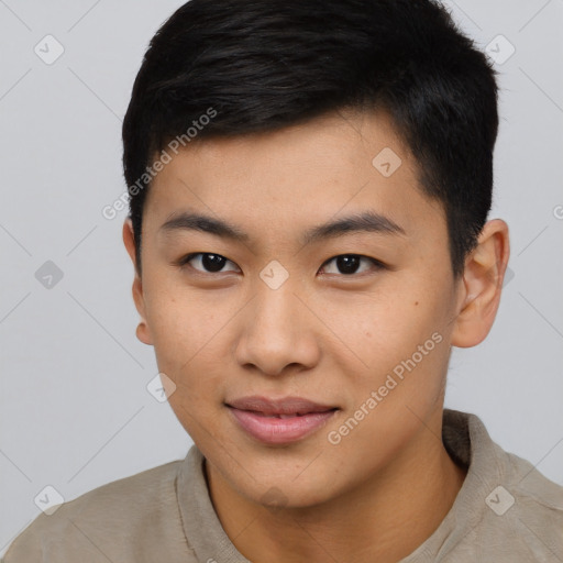 Joyful asian young-adult male with short  black hair and brown eyes