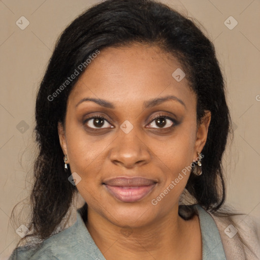 Joyful black young-adult female with long  brown hair and brown eyes