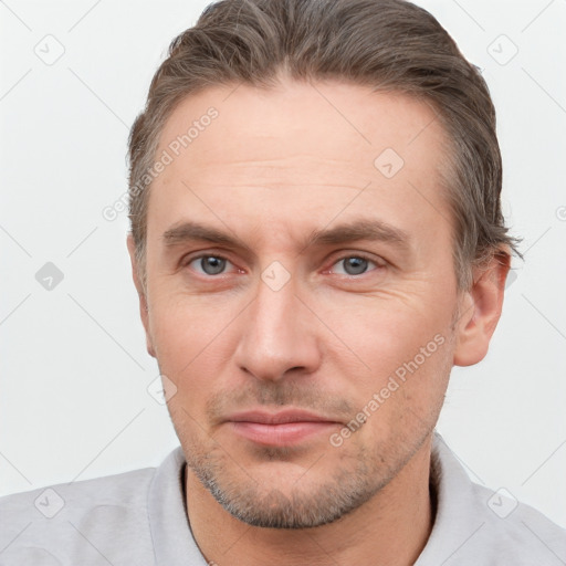 Neutral white adult male with short  brown hair and brown eyes