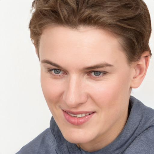 Joyful white young-adult female with short  brown hair and blue eyes