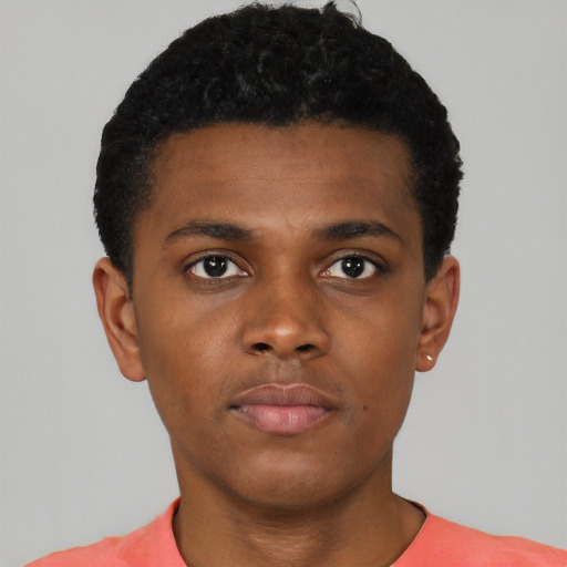 Neutral black young-adult male with short  black hair and brown eyes