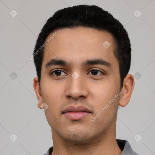 Neutral latino young-adult male with short  black hair and brown eyes