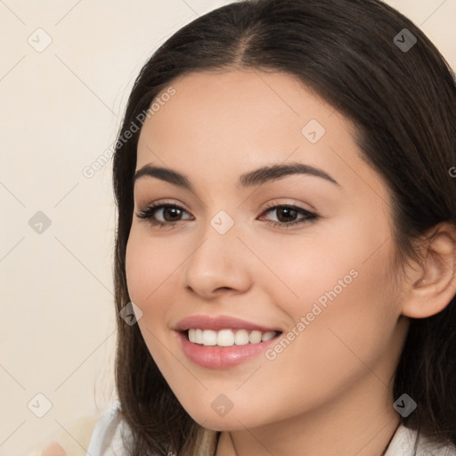 Joyful white young-adult female with long  brown hair and brown eyes