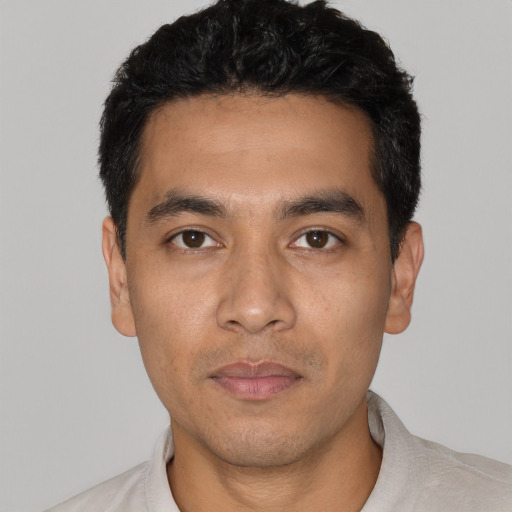 Neutral white young-adult male with short  black hair and brown eyes