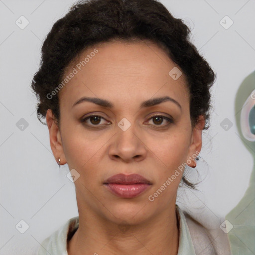 Joyful black adult female with short  brown hair and brown eyes