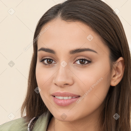 Joyful white young-adult female with long  brown hair and brown eyes