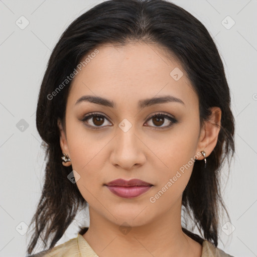 Joyful latino young-adult female with medium  brown hair and brown eyes