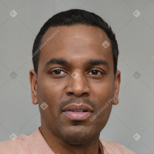 Neutral latino young-adult male with short  black hair and brown eyes
