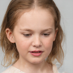 Joyful white child female with medium  brown hair and grey eyes