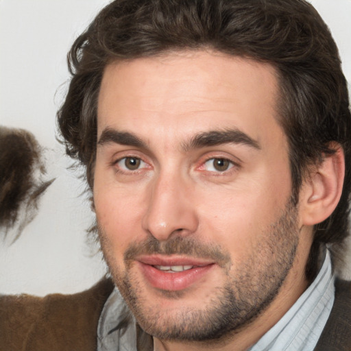 Joyful white adult male with short  brown hair and brown eyes