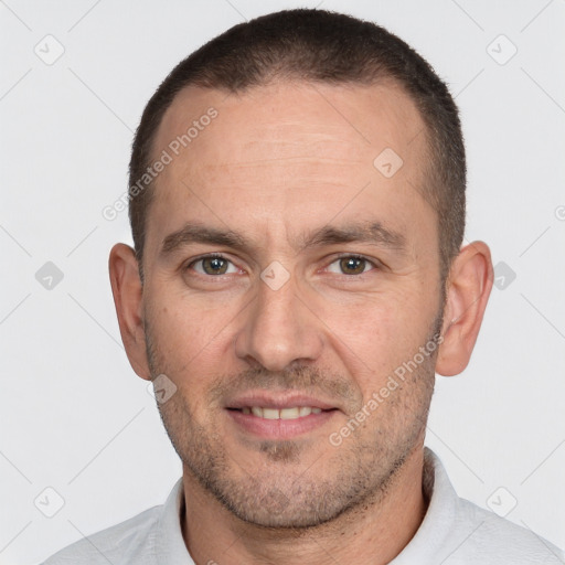 Joyful white adult male with short  brown hair and brown eyes