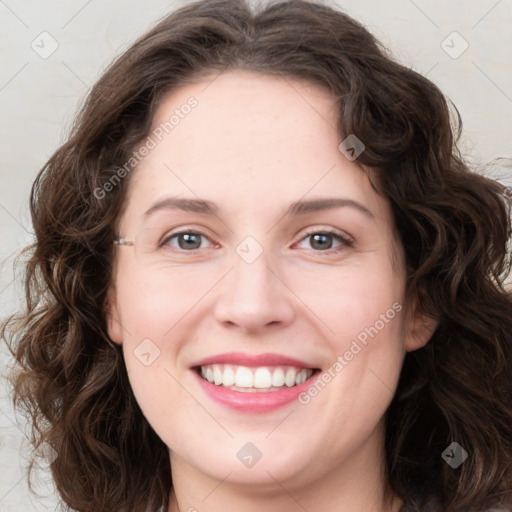 Joyful white young-adult female with long  brown hair and green eyes