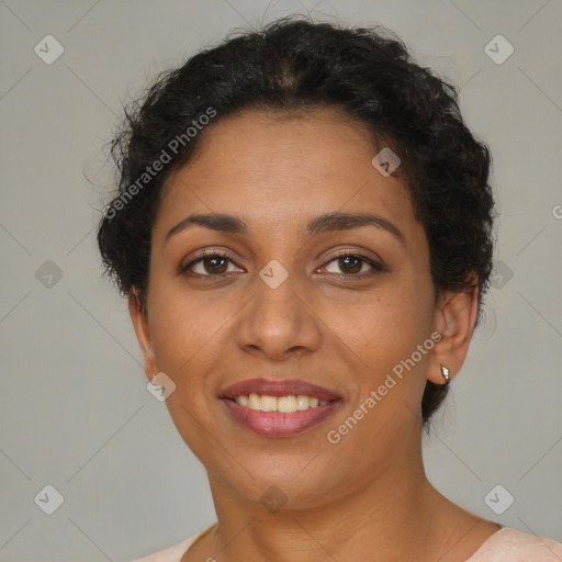 Joyful latino young-adult female with short  brown hair and brown eyes