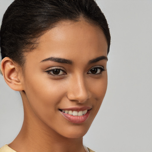 Joyful latino young-adult female with short  brown hair and brown eyes